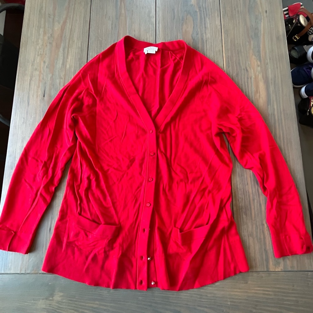 Red Kate Spade cardigan.
